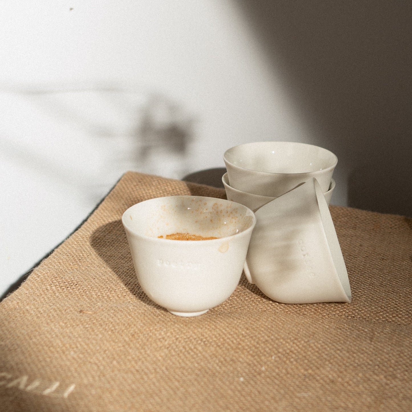 four white espresso cups