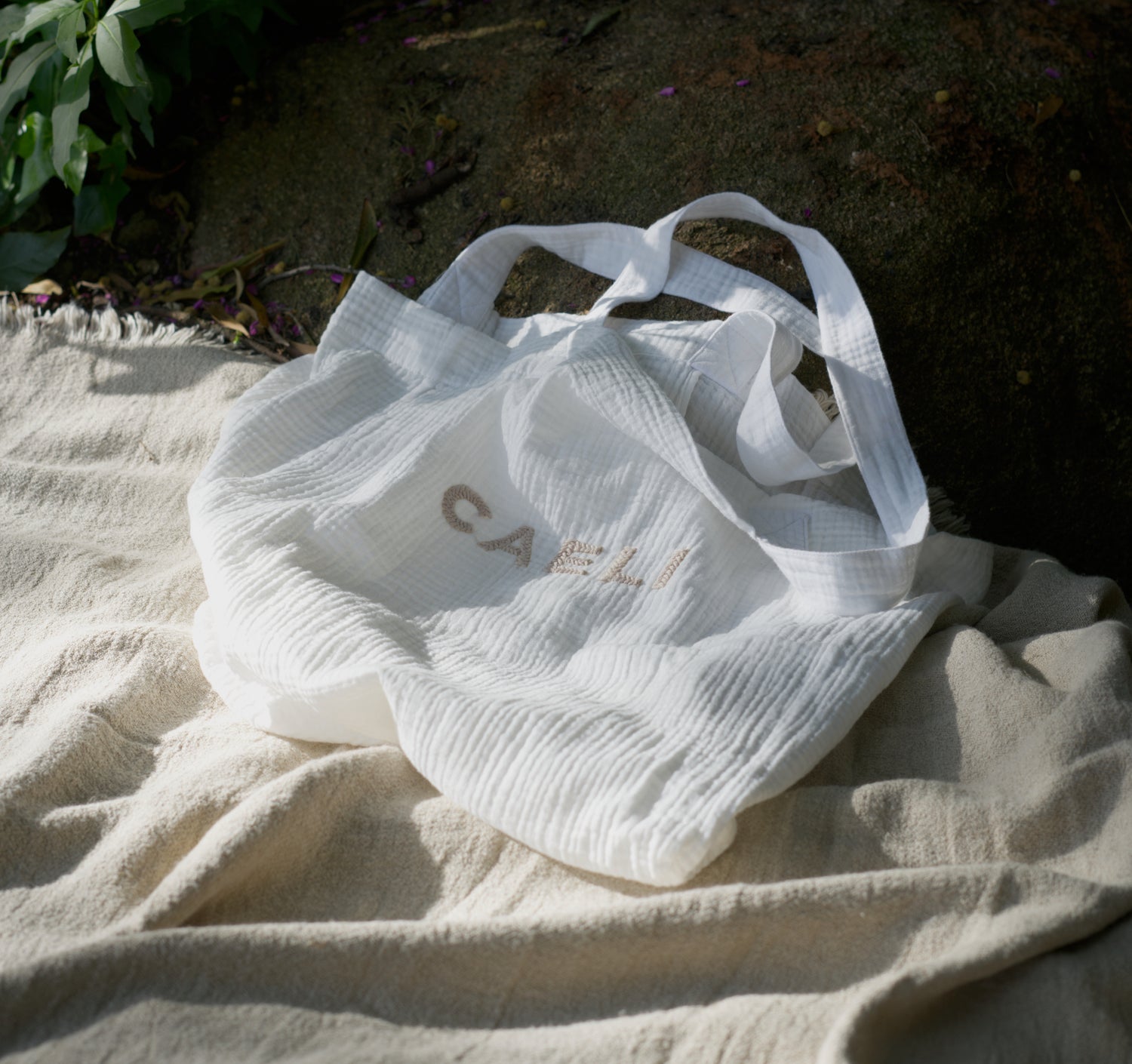 white tote bag with caeli logo